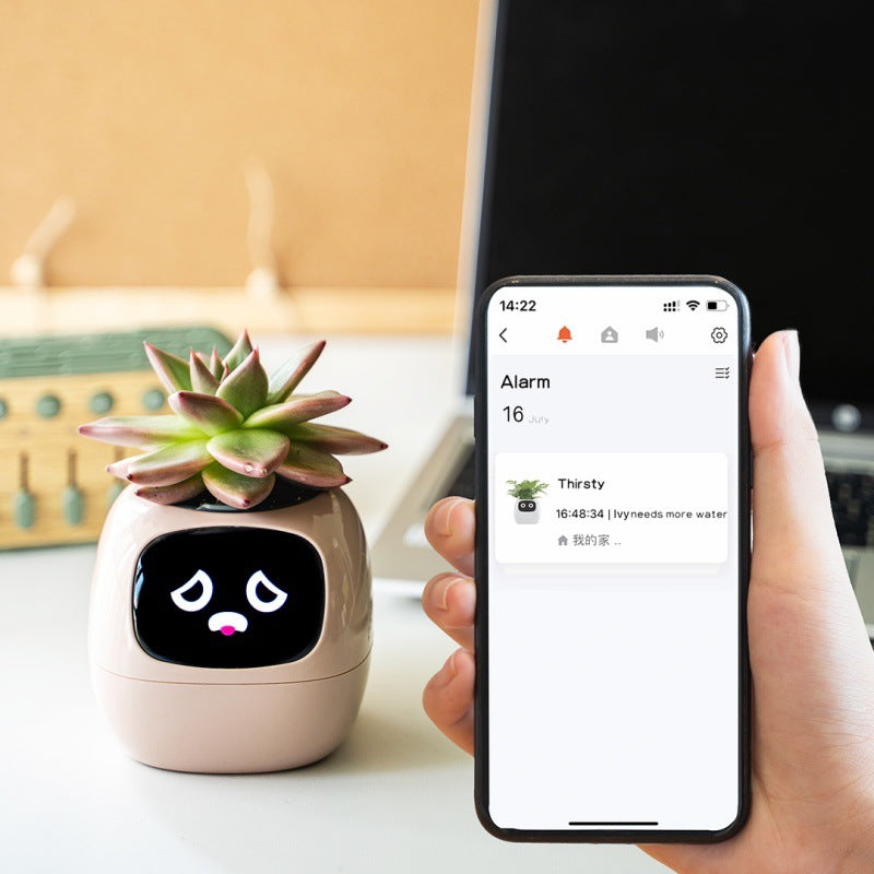 Smart plant pot with a digital display and a phone showing an app interface.