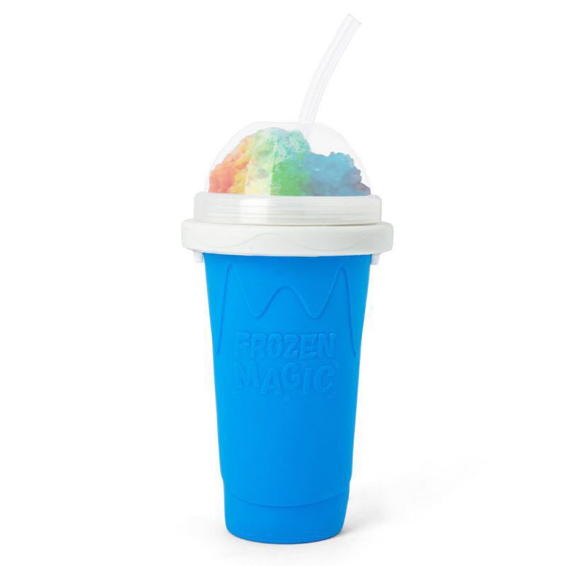 Blue slushy maker cup with rainbow shaved ice on a white background